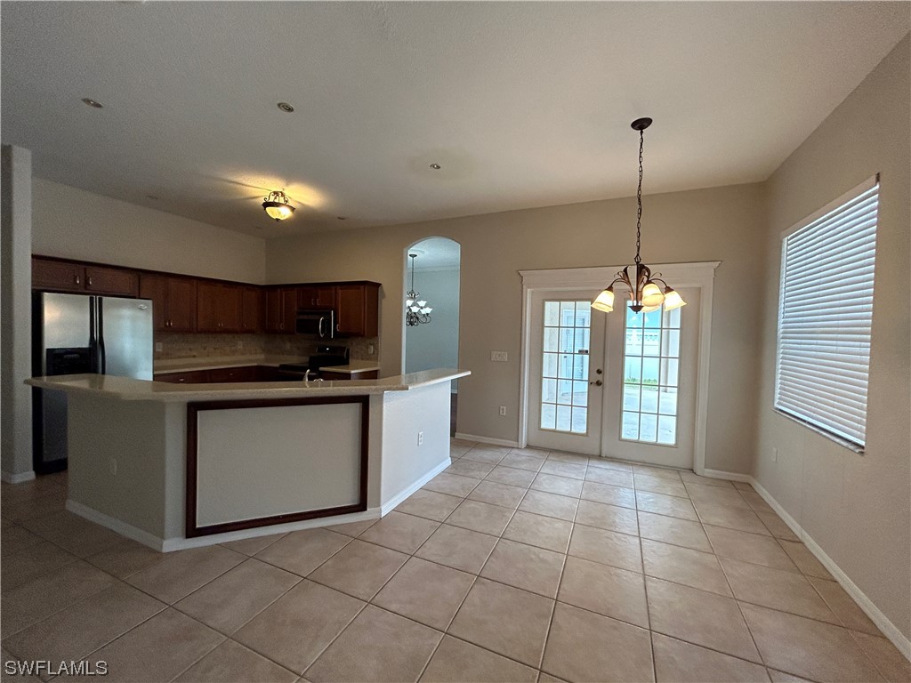 2562 Nature Pointe Loop Fort Myers, FL 33905 - Photo 18 of 44 a kitchen with a sink and cabinets
