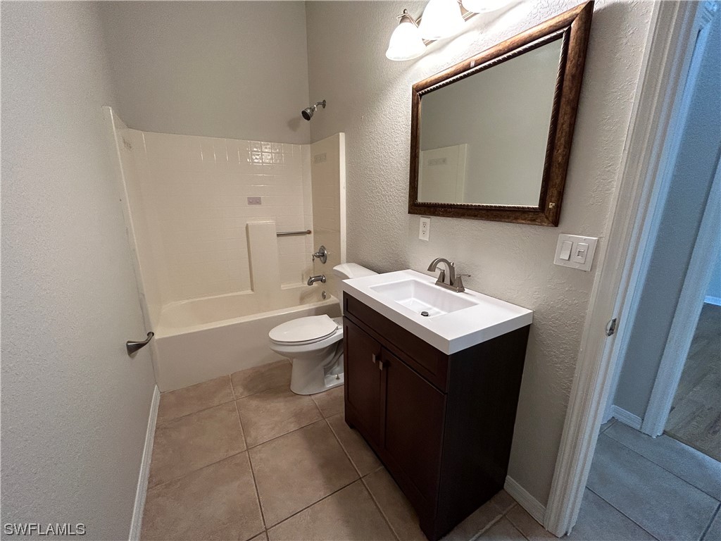 2562 Nature Pointe Loop Fort Myers, FL 33905 - Photo 24 of 44 a bathroom with a sink mirror and toilet