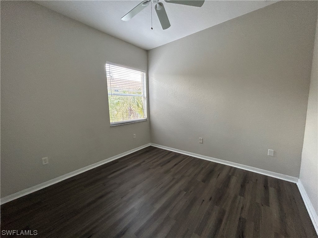 2562 Nature Pointe Loop Fort Myers, FL 33905 - Photo 28 of 44 wooden floor in an empty room with a window