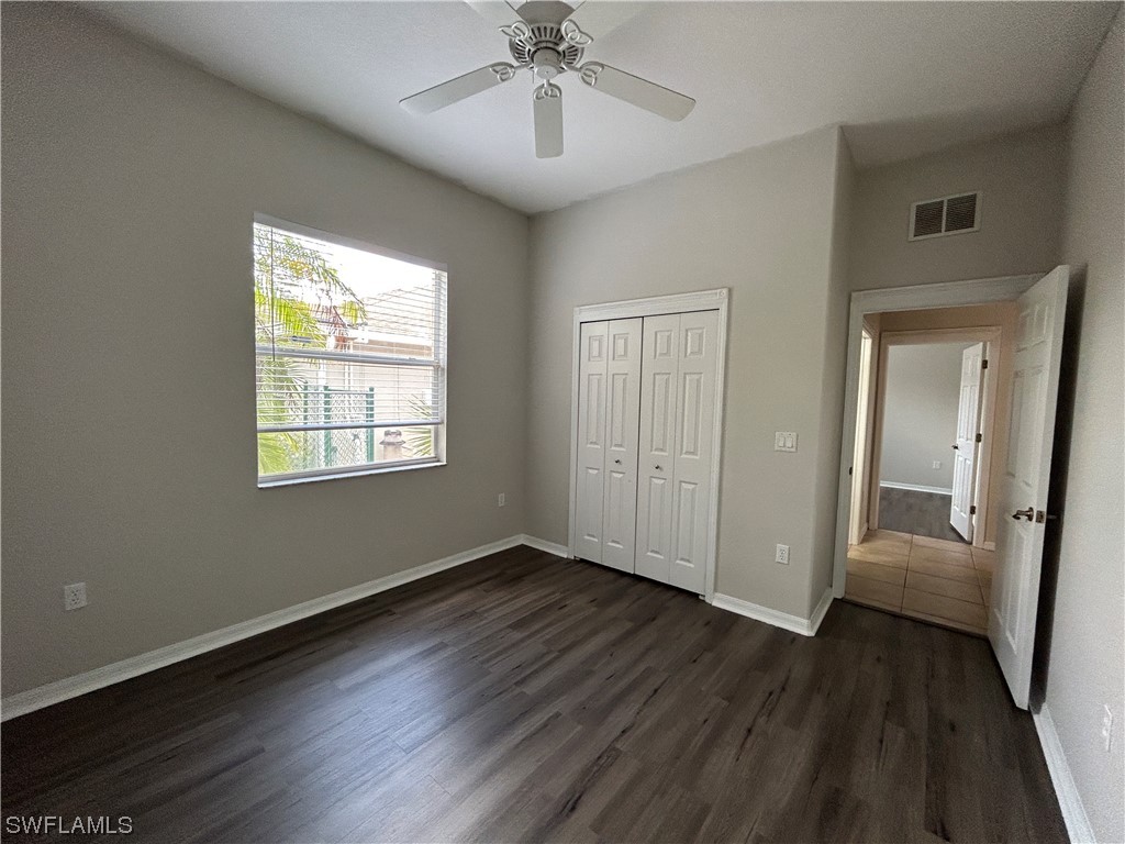 2562 Nature Pointe Loop Fort Myers, FL 33905 - Photo 30 of 44 a view of an empty room with wooden floor and a window
