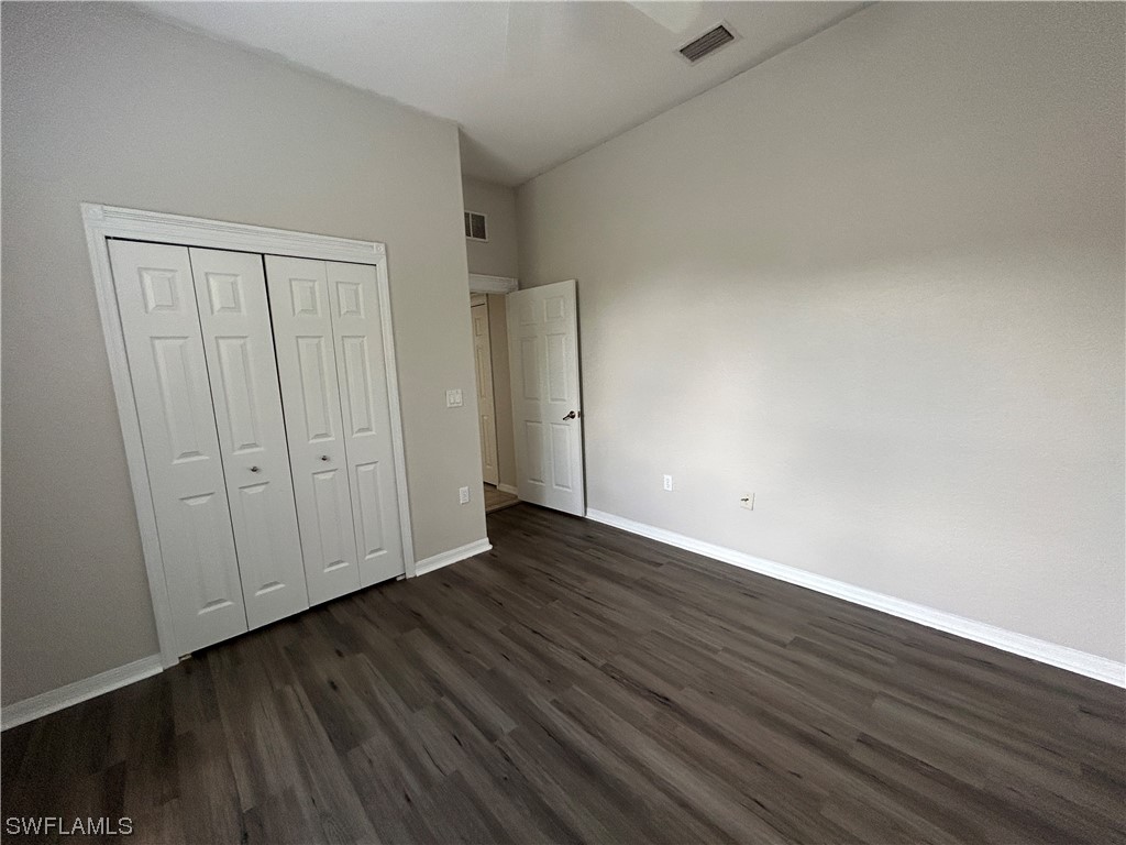 2562 Nature Pointe Loop Fort Myers, FL 33905 - Photo 31 of 44 a view of an empty room with wooden floor
