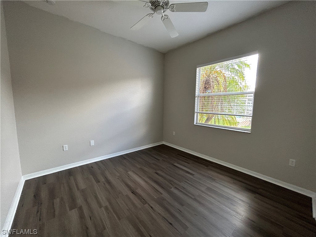 2562 Nature Pointe Loop Fort Myers, FL 33905 - Photo 32 of 44 an empty room with wooden floor and windows