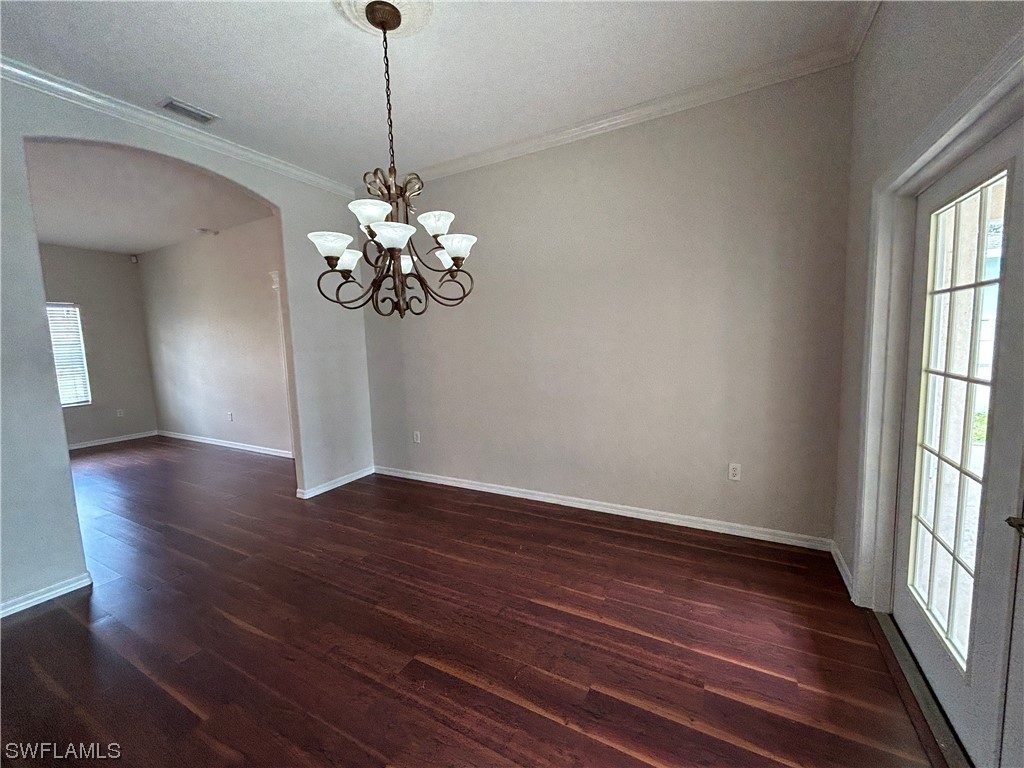 2562 Nature Pointe Loop Fort Myers, FL 33905 - Photo 33 of 44 a view of a room with wooden floor and chandelier