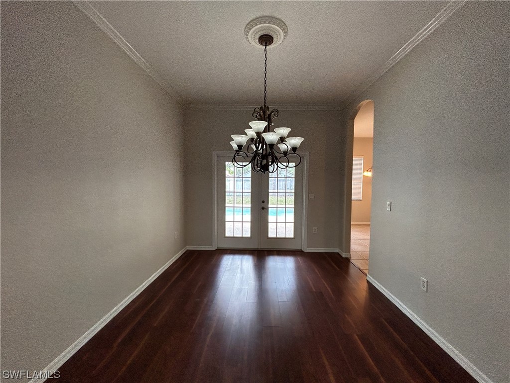 2562 Nature Pointe Loop Fort Myers, FL 33905 - Photo 34 of 44 a view of a room with wooden floor chandelier and a window
