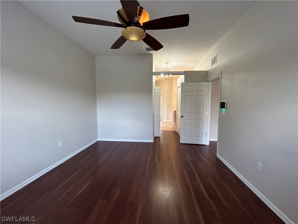 2562 Nature Pointe Loop Fort Myers, FL 33905 - Photo 36 of 44 wooden floor in an empty room with a window