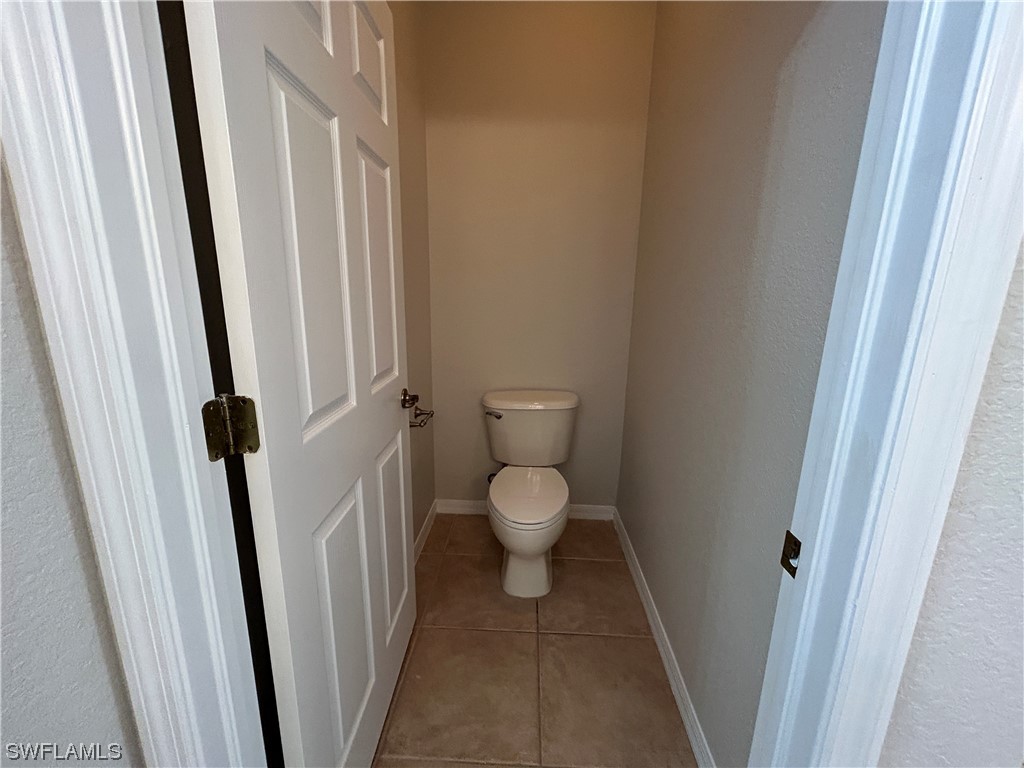 2562 Nature Pointe Loop Fort Myers, FL 33905 - Photo 39 of 44 a bathroom with a toilet and a shower
