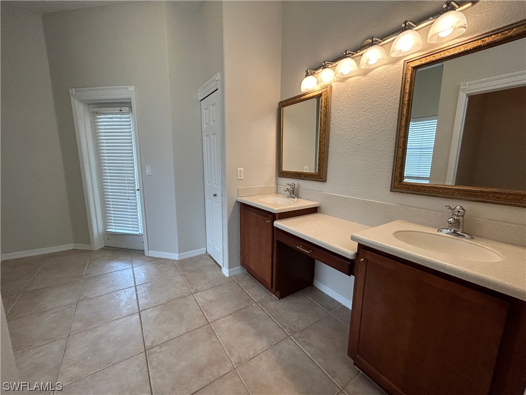 2562 Nature Pointe Loop Fort Myers, FL 33905 - Photo 41 of 44 a bathroom with a sink vanity and mirror