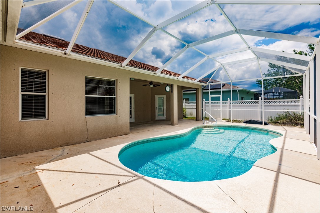 2562 Nature Pointe Loop Fort Myers, FL 33905 - Photo 6 of 44 a view of a backyard with a small swimming pool