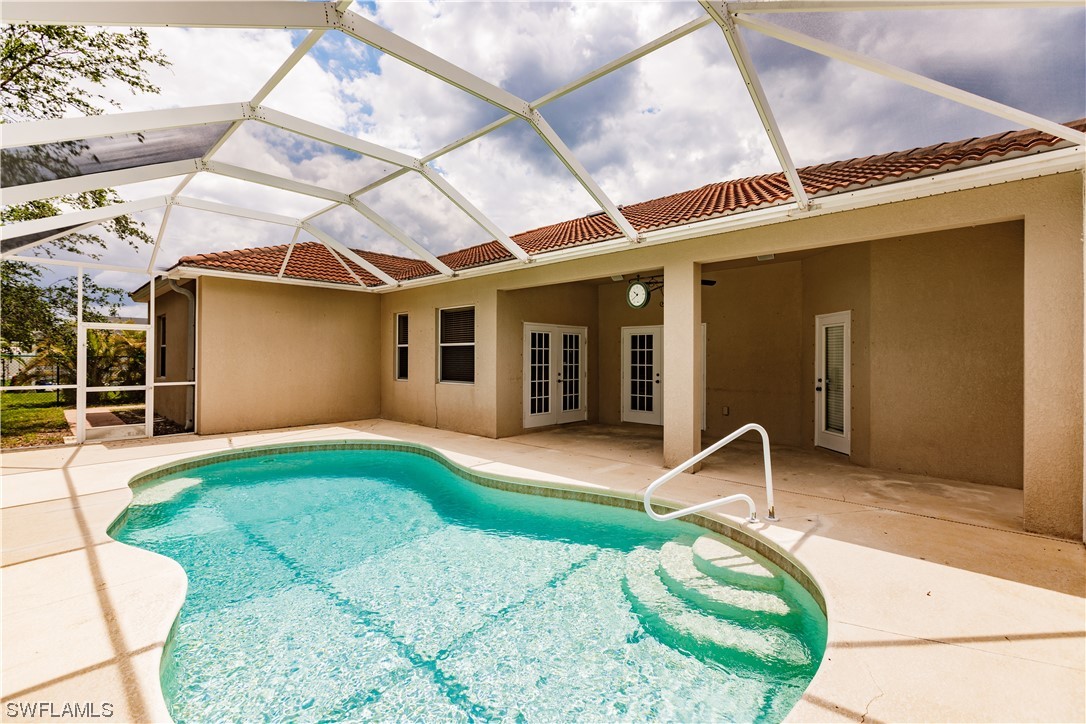 2562 Nature Pointe Loop Fort Myers, FL 33905 - Photo 7 of 44 a backyard of a house with table and chairs