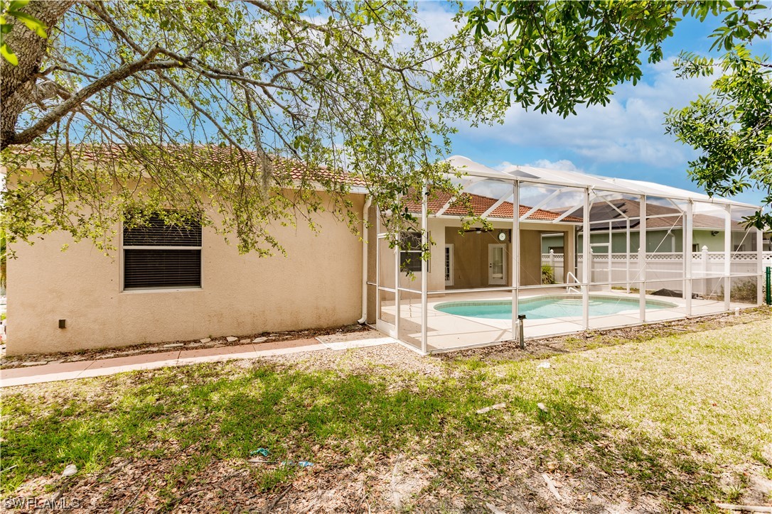 2562 Nature Pointe Loop Fort Myers, FL 33905 - Photo 10 of 44 a house with trees in the background
