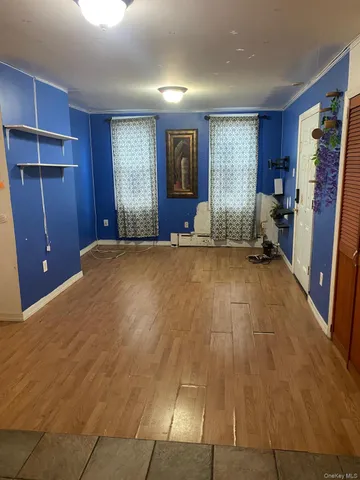 a view of a livingroom with furniture and closet