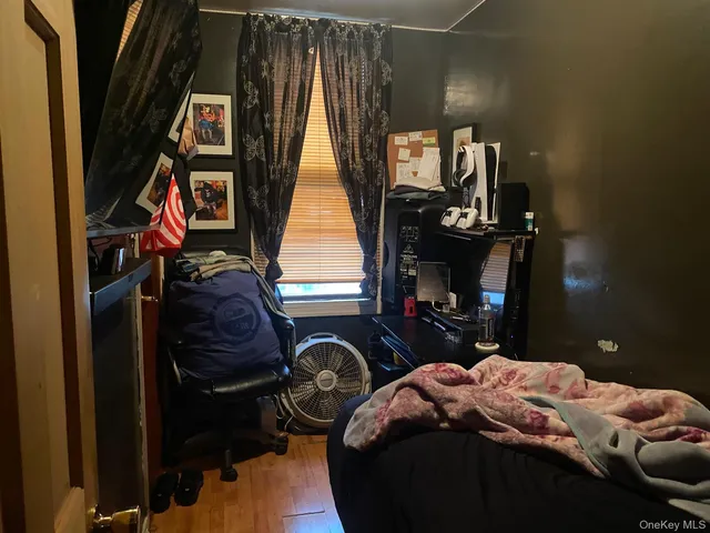 a bathroom with a toilet a sink and a mirror