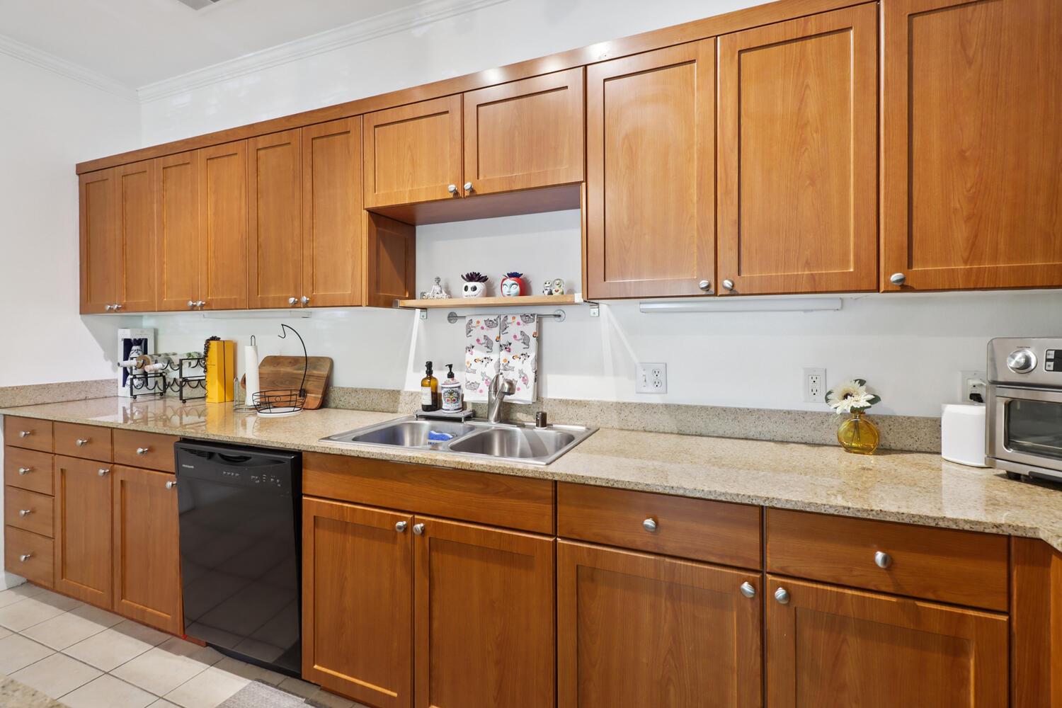 1818 Moore Boulevard, Unit 201 Davis, CA 95618 - Photo 11 of 40 a kitchen with a sink cabinets and a window