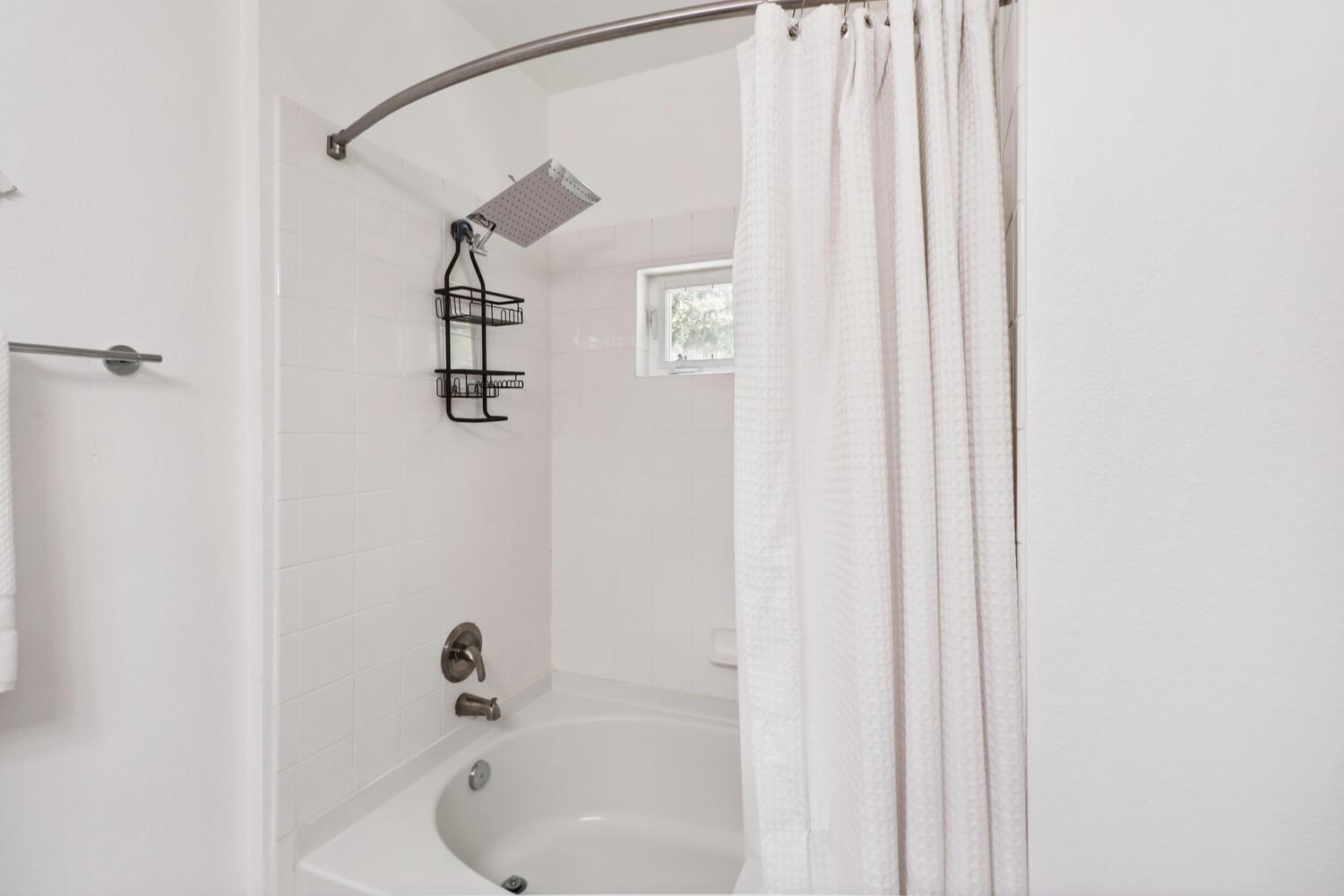 1818 Moore Boulevard, Unit 201 Davis, CA 95618 - Photo 17 of 40 a bathroom with a shower and a sink