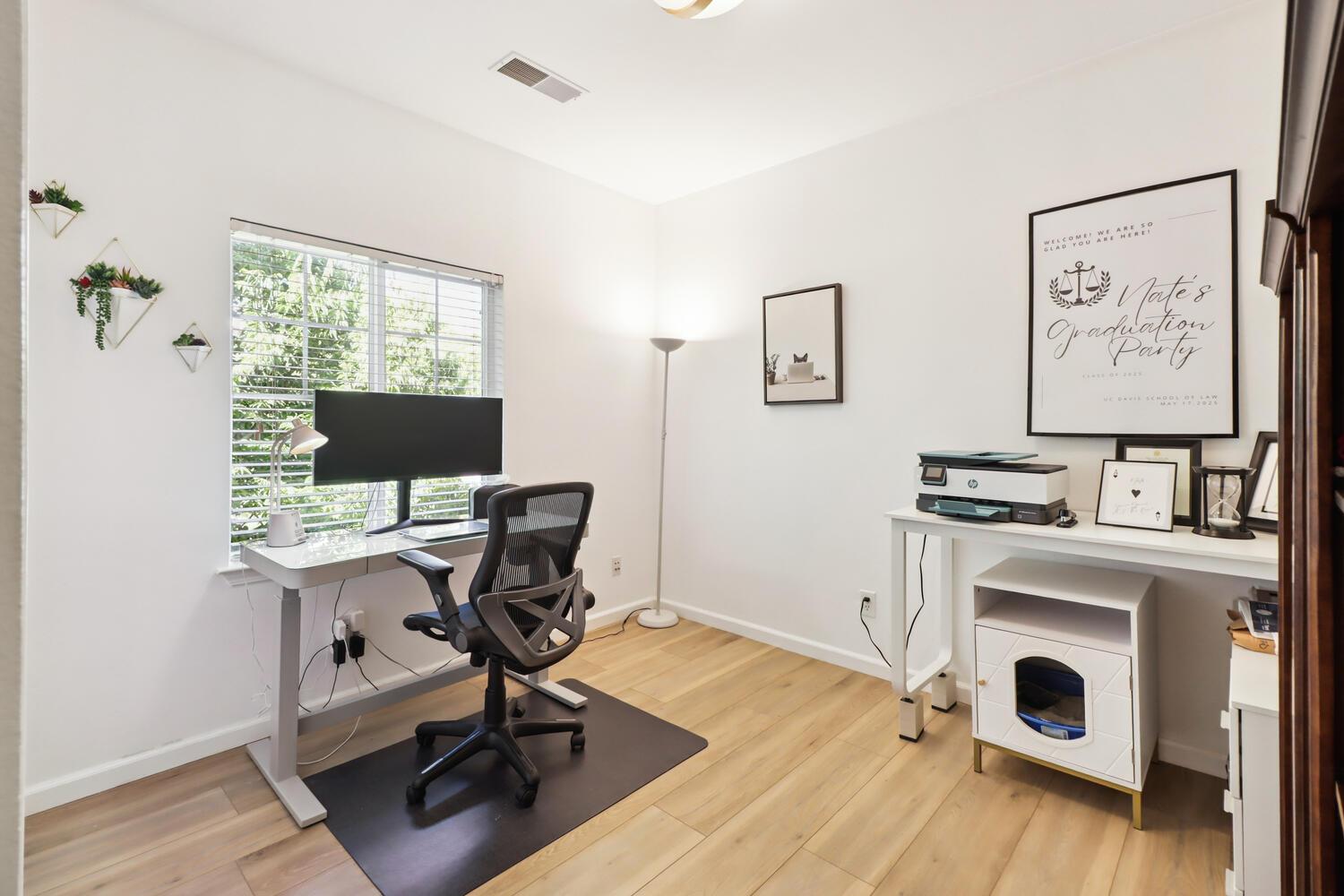 1818 Moore Boulevard, Unit 201 Davis, CA 95618 - Photo 18 of 40 a view of a workspace with furniture and a window