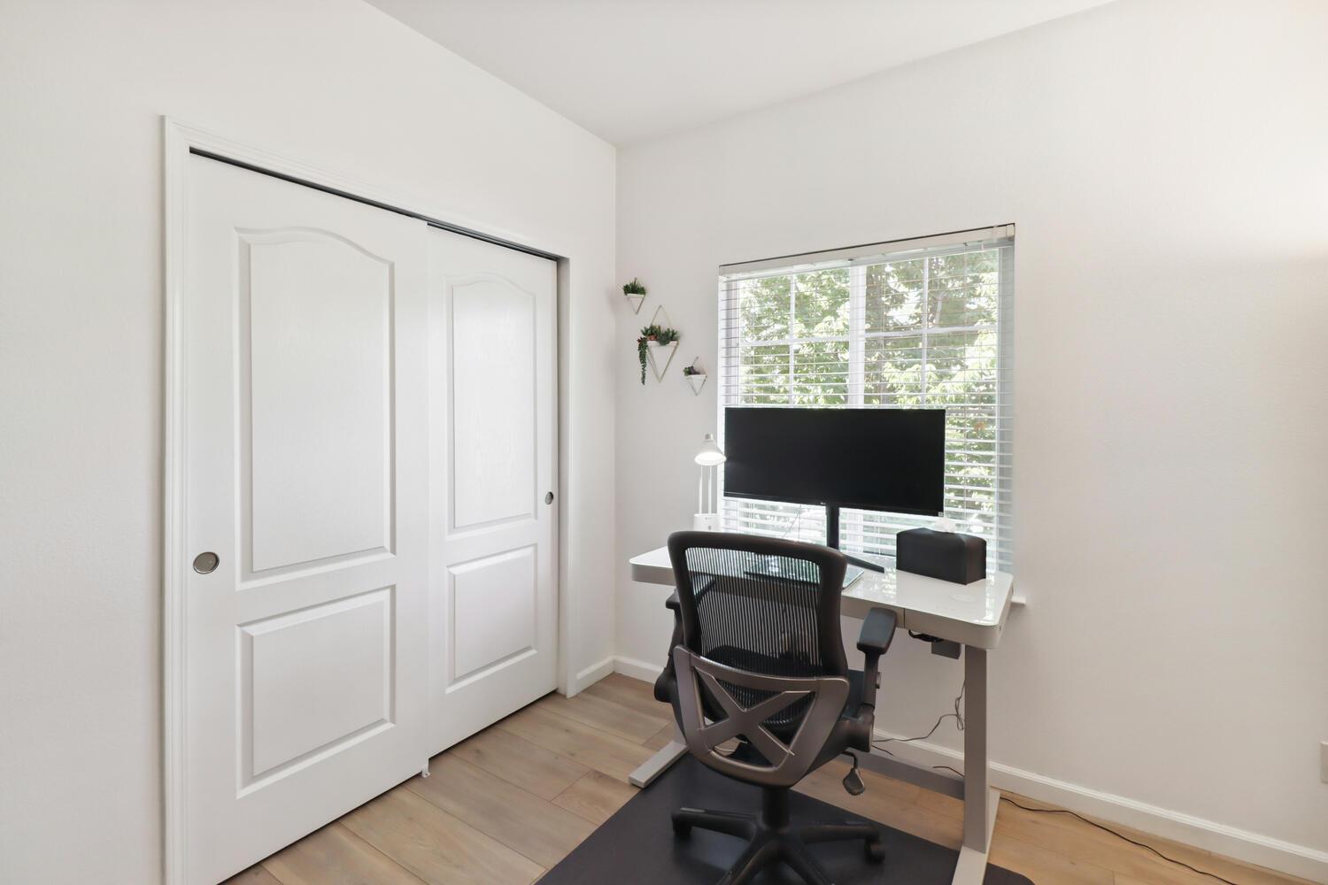 1818 Moore Boulevard, Unit 201 Davis, CA 95618 - Photo 19 of 40 a view of a workspace with furniture and a window