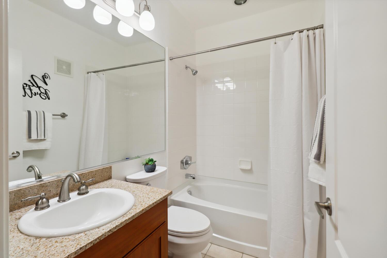 1818 Moore Boulevard, Unit 201 Davis, CA 95618 - Photo 20 of 40 a bathroom with a sink a toilet and shower