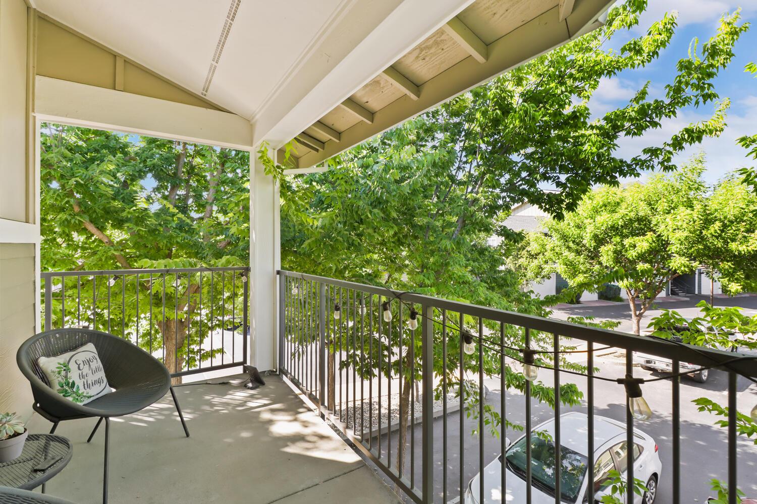 1818 Moore Boulevard, Unit 201 Davis, CA 95618 - Photo 23 of 40 a view of a chair and table in the balcony