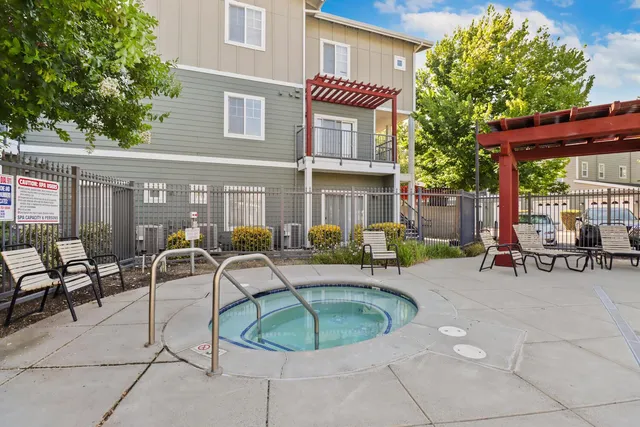 a swimming pool with outdoor seating and yard