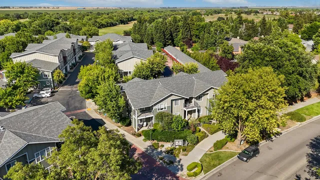 an aerial view of a house with a yard