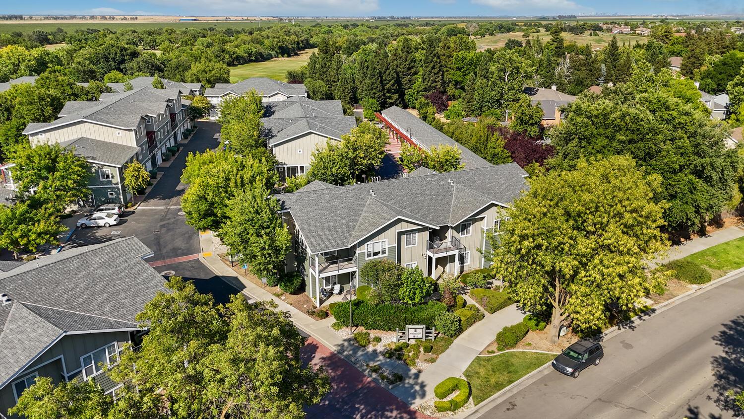 1818 Moore Boulevard, Unit 201 Davis, CA 95618 - Photo 30 of 40 an aerial view of a house with a yard