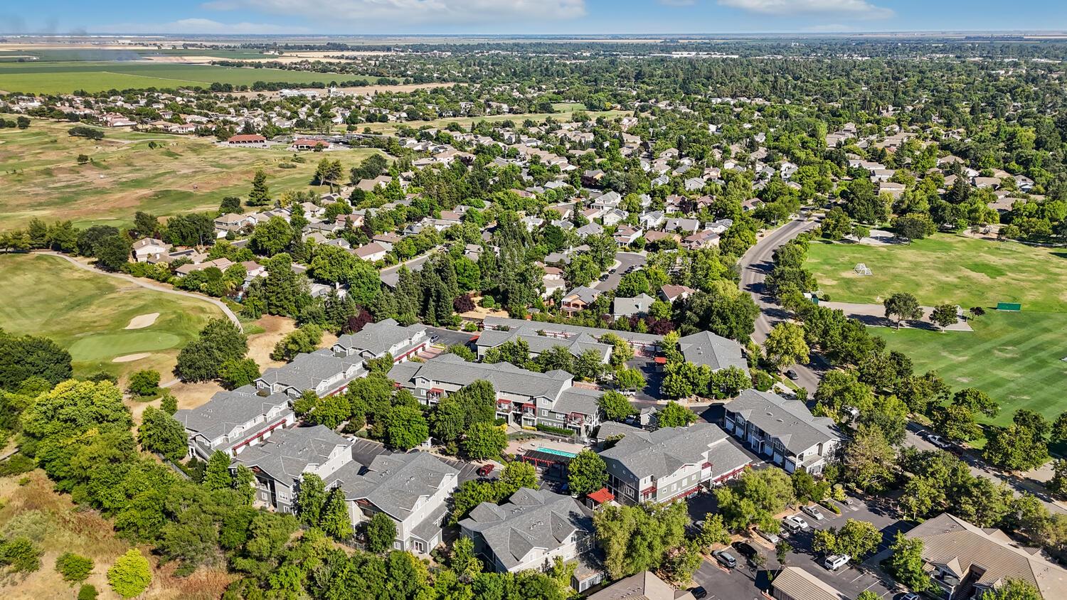 1818 Moore Boulevard, Unit 201 Davis, CA 95618 - Photo 34 of 40 an aerial view of residential houses with outdoor space