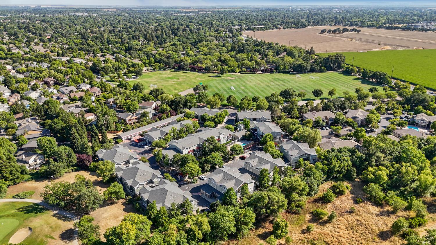 1818 Moore Boulevard, Unit 201 Davis, CA 95618 - Photo 35 of 40 an aerial view of a city with lots of residential buildings