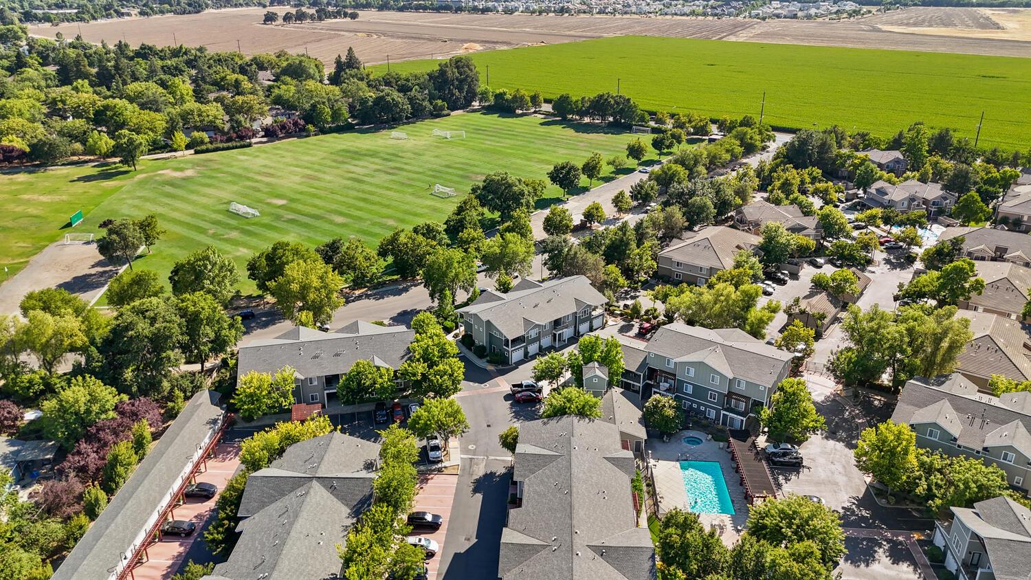 1818 Moore Boulevard, Unit 201 Davis, CA 95618 - Photo 39 of 40 an aerial view of a houses with a garden