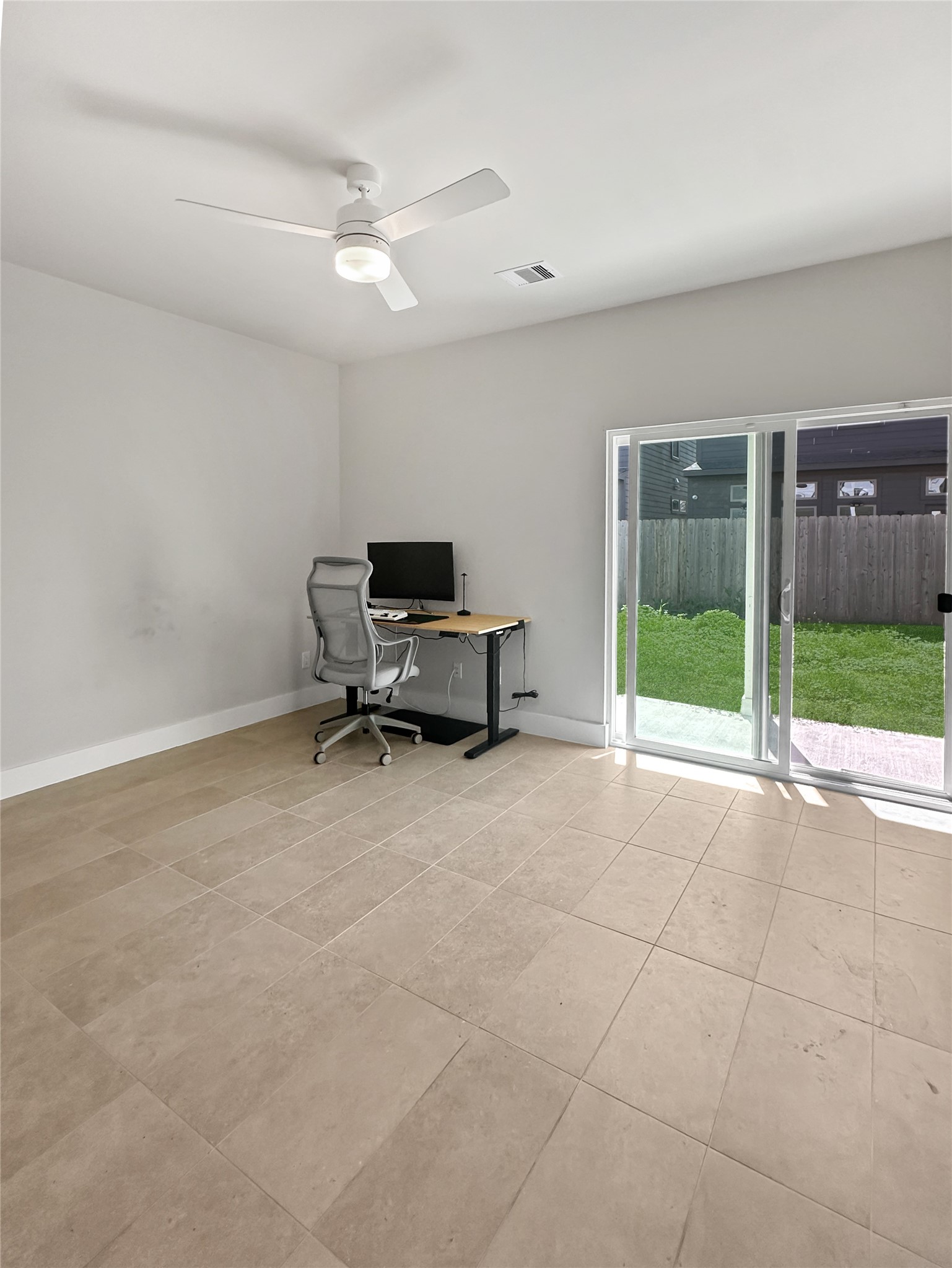 4702 Oats Street, Unit B Houston, TX 77020 - Photo 16 of 20 a view of a livingroom with furniture and a ceiling fan