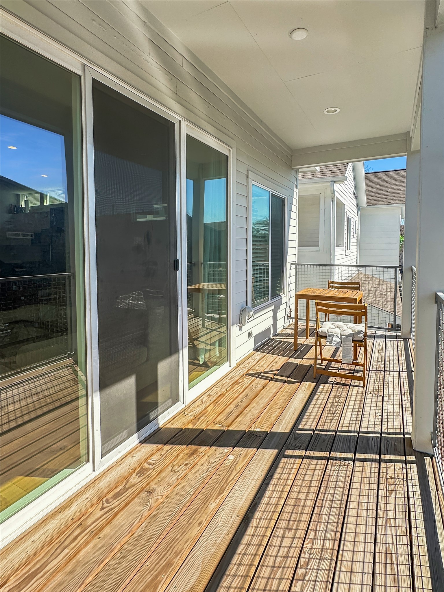 4702 Oats Street, Unit B Houston, TX 77020 - Photo 19 of 20 a view of a balcony with wooden floor