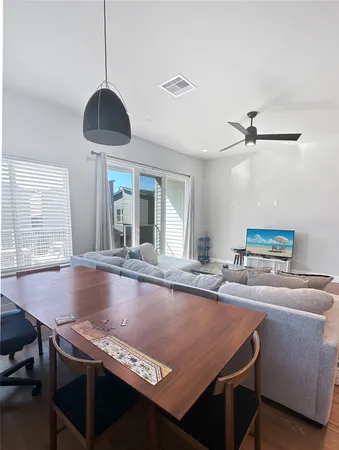 a dining table with chairs and window