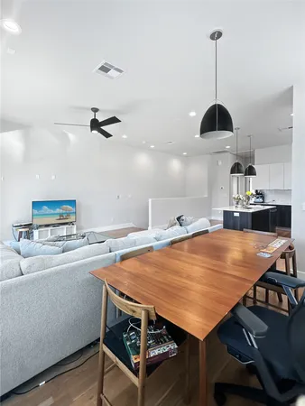 a room with furniture and wooden floor