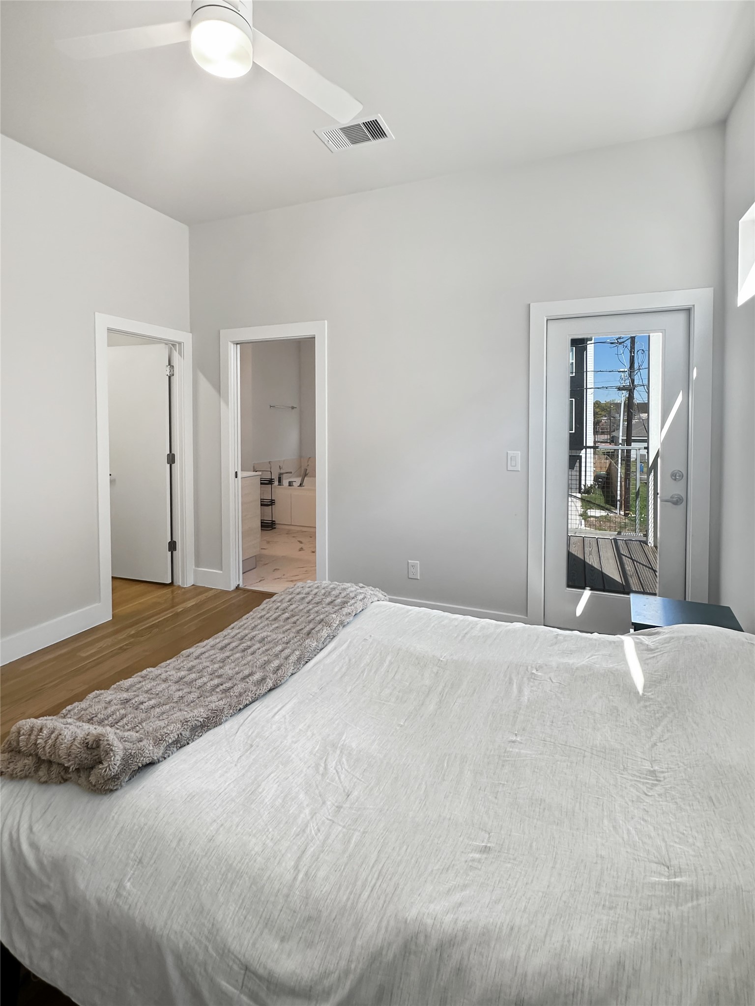 4702 Oats Street, Unit B Houston, TX 77020 - Photo 9 of 20 a view of empty room with wooden floor and fan