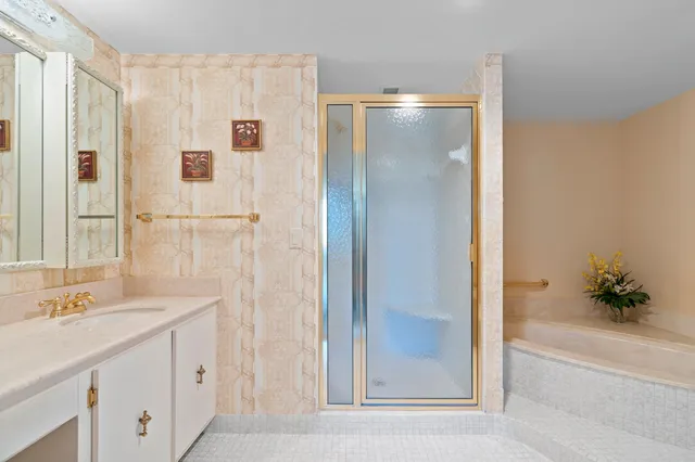a bathroom with a shower sink and mirror