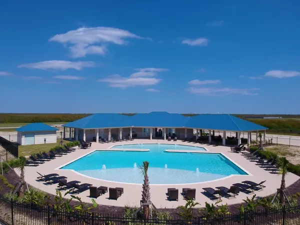 an aerial view of a house with swimming pool yard and outdoor seating