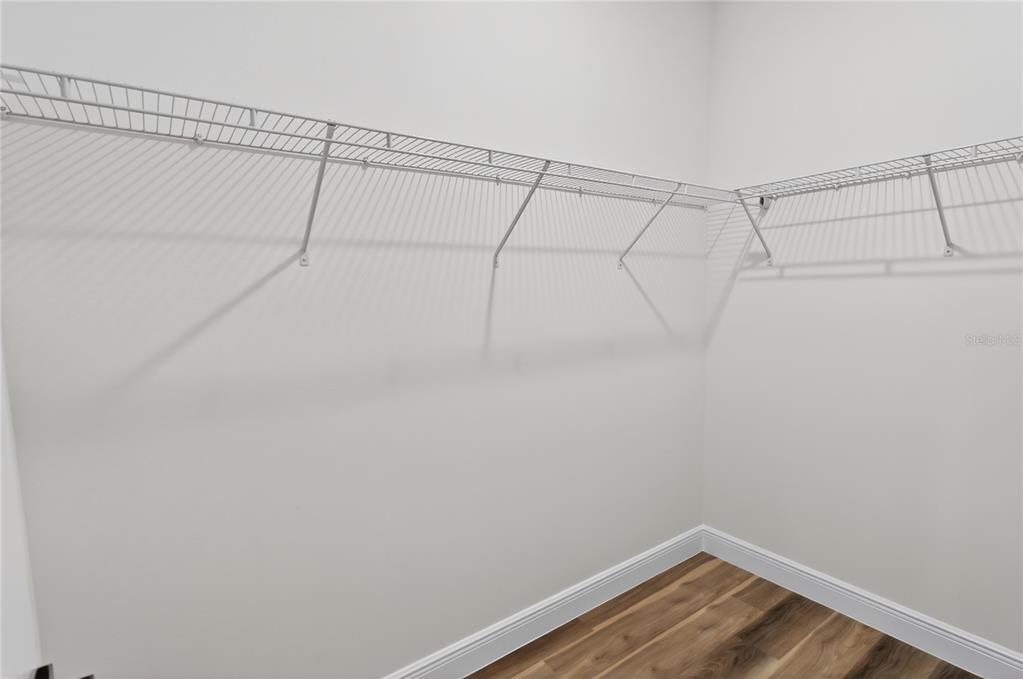 9066 North Akola Way Citrus Springs, FL 34434 - Photo 15 of 32 a view of a room with racks on the wall