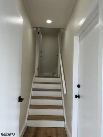 a view of staircase with white walls