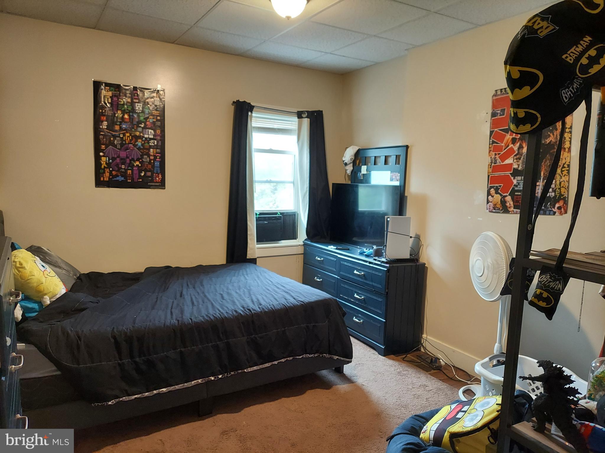 560 North Pershing Avenue York, PA 17404 - Photo 7 of 13 a bedroom with a bed and dresser