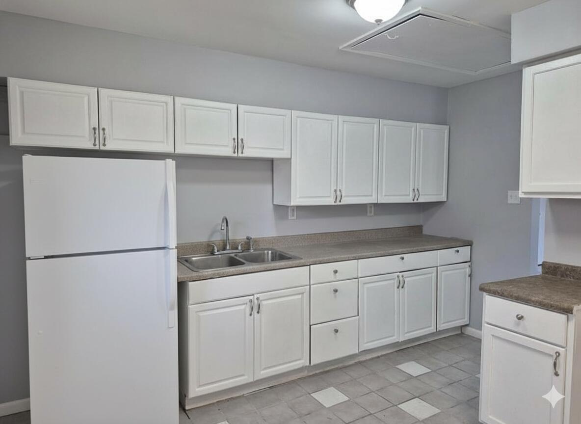 3326 Delaware Street Gary, IN 46409 - Photo 3 of 13 a kitchen with appliances a sink and cabinets