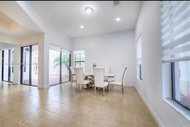 a kitchen with stainless steel appliances granite countertop a refrigerator stove and microwave