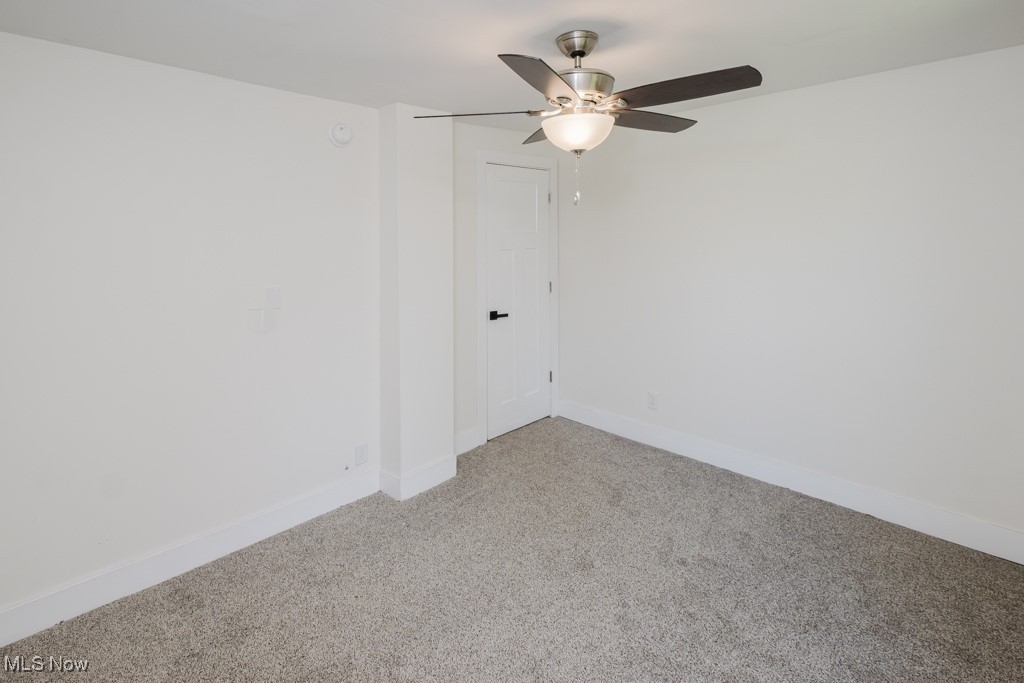8150 Madison Road Thompson, OH 44086 - Photo 18 of 28 Carpeted empty room with baseboards and ceiling fan
