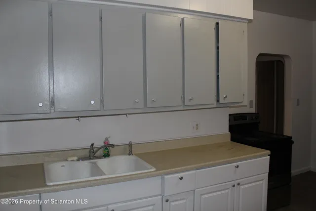a bathroom with a sink and cabinets