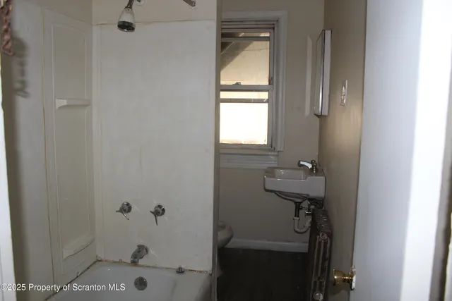 a bathroom with a sink and tub