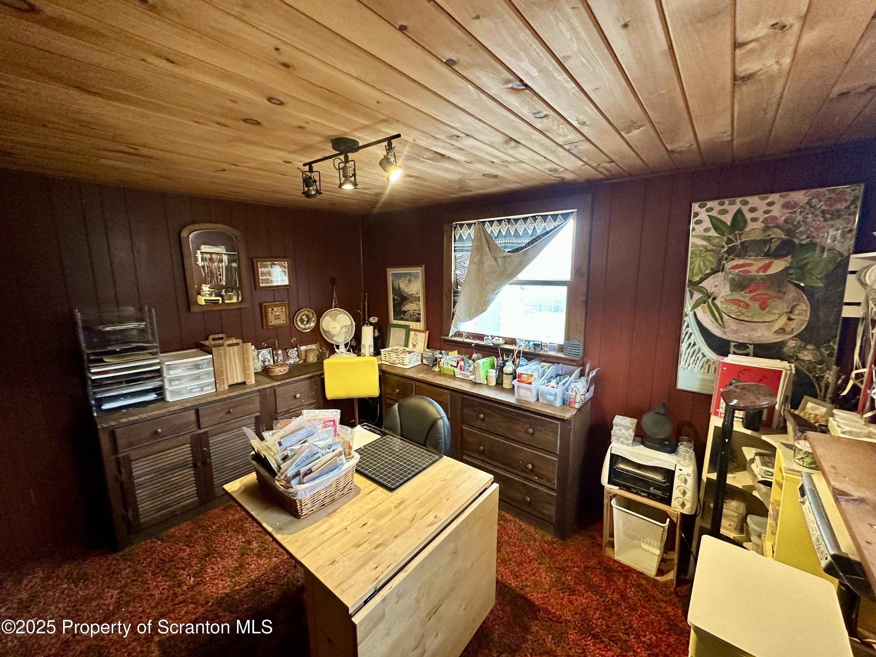 1033 Sugar Hollow Road Tunkhannock, PA 18657 - Photo 14 of 27 a living room with furniture a window and a chandelier