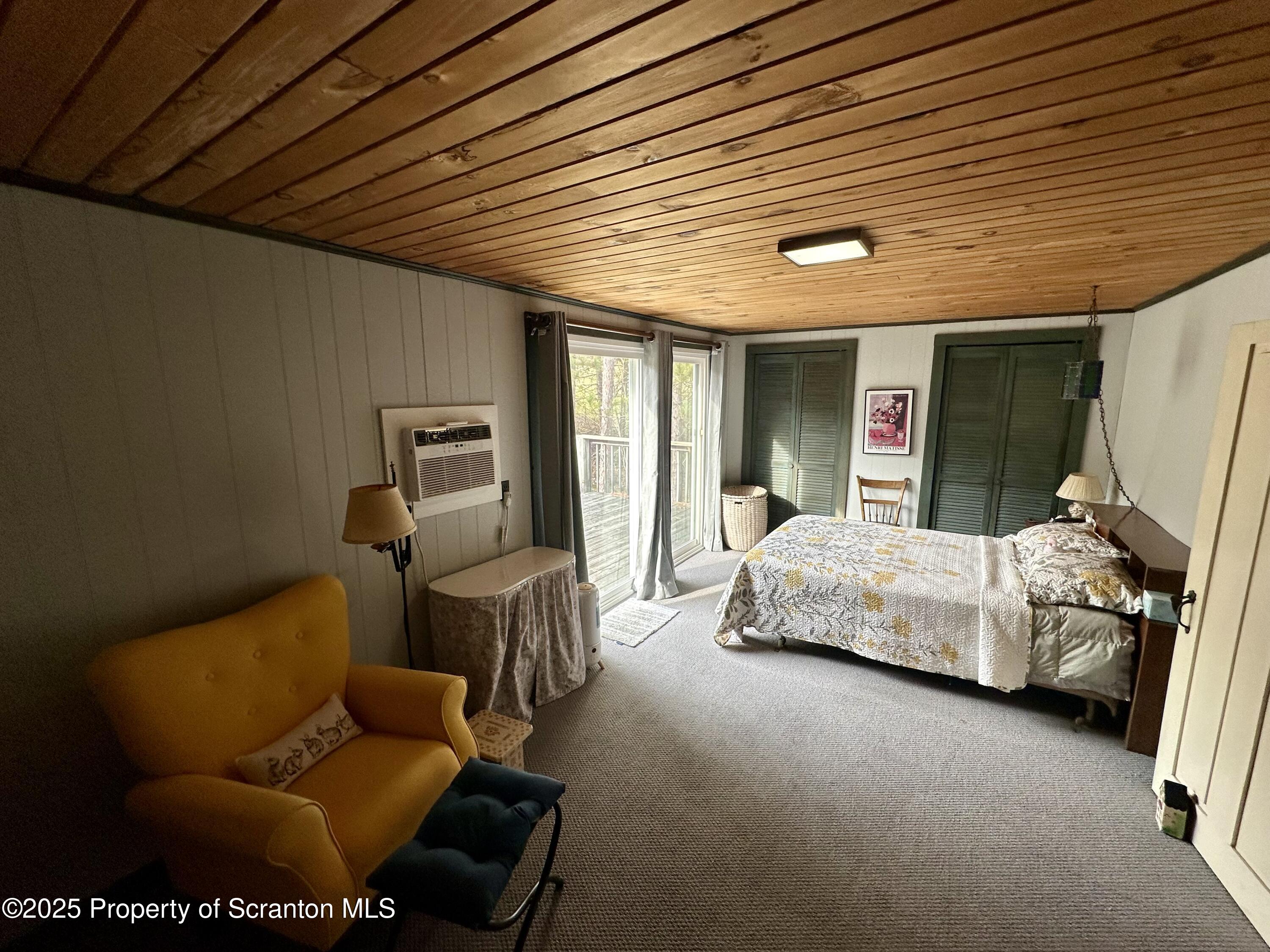 1033 Sugar Hollow Road Tunkhannock, PA 18657 - Photo 16 of 27 a bedroom with furniture and a large window