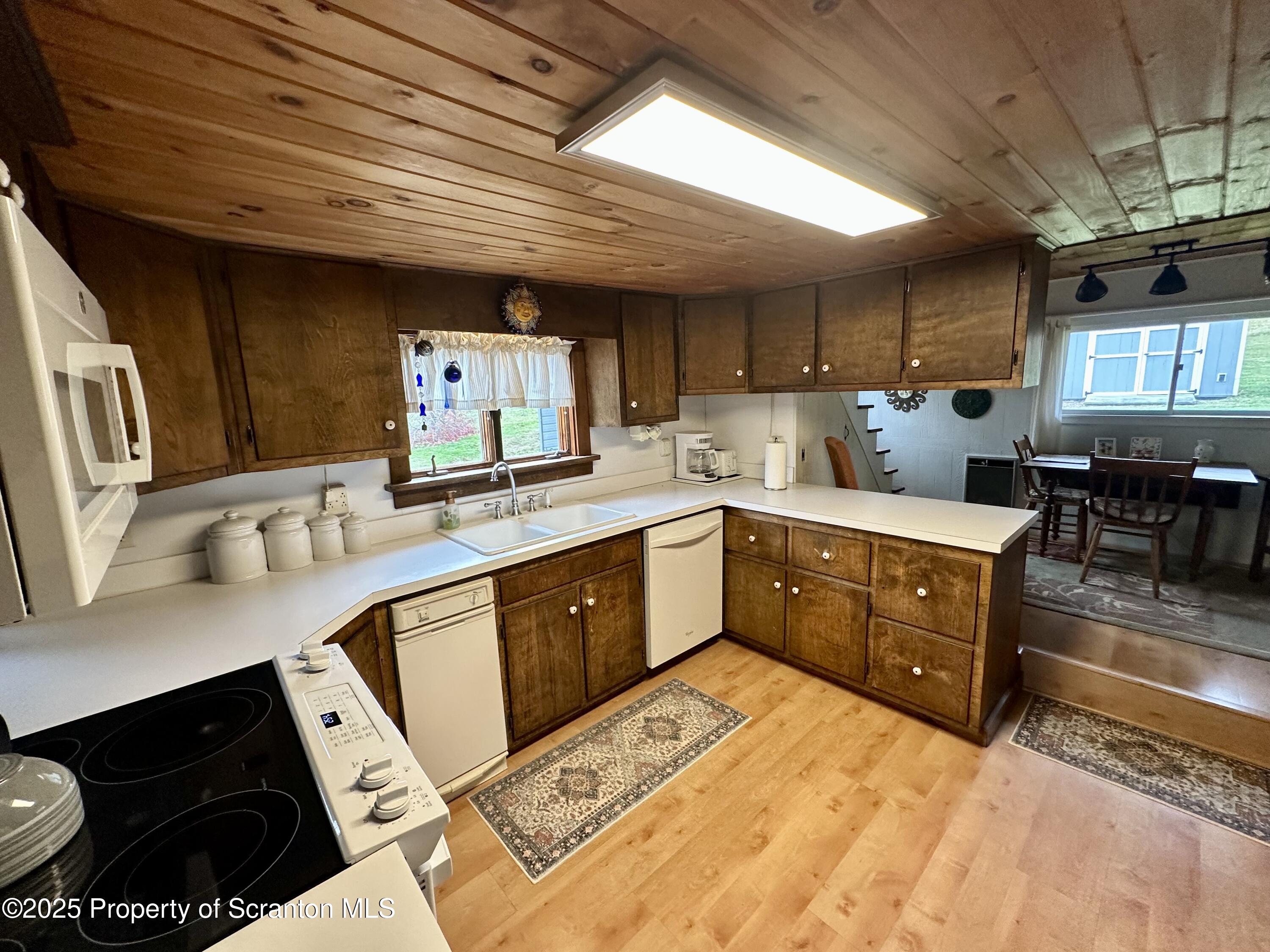 1033 Sugar Hollow Road Tunkhannock, PA 18657 - Photo 4 of 27 a kitchen with stainless steel appliances granite countertop a sink stove and cabinets