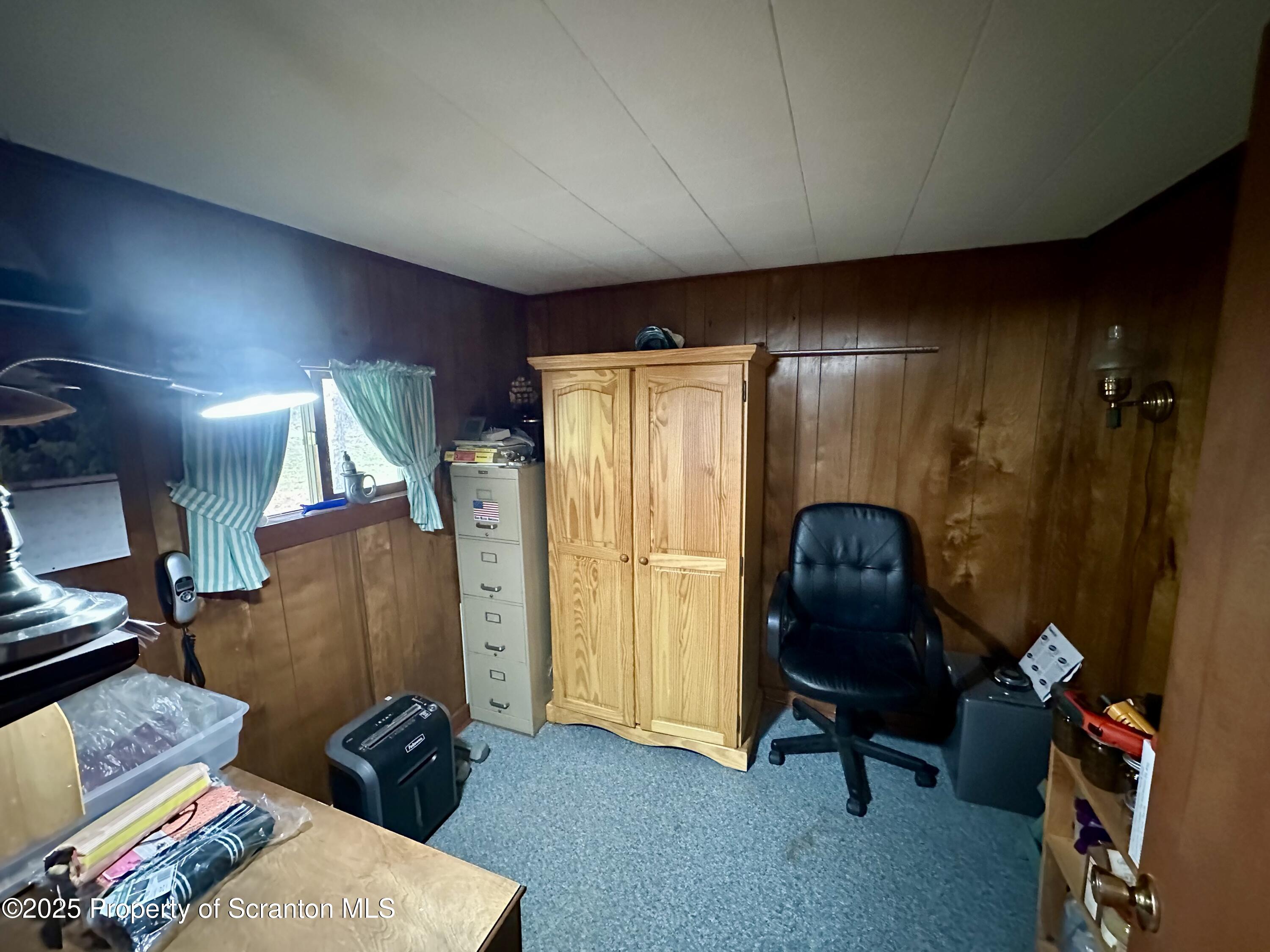 1033 Sugar Hollow Road Tunkhannock, PA 18657 - Photo 8 of 27 a living room with furniture and a window