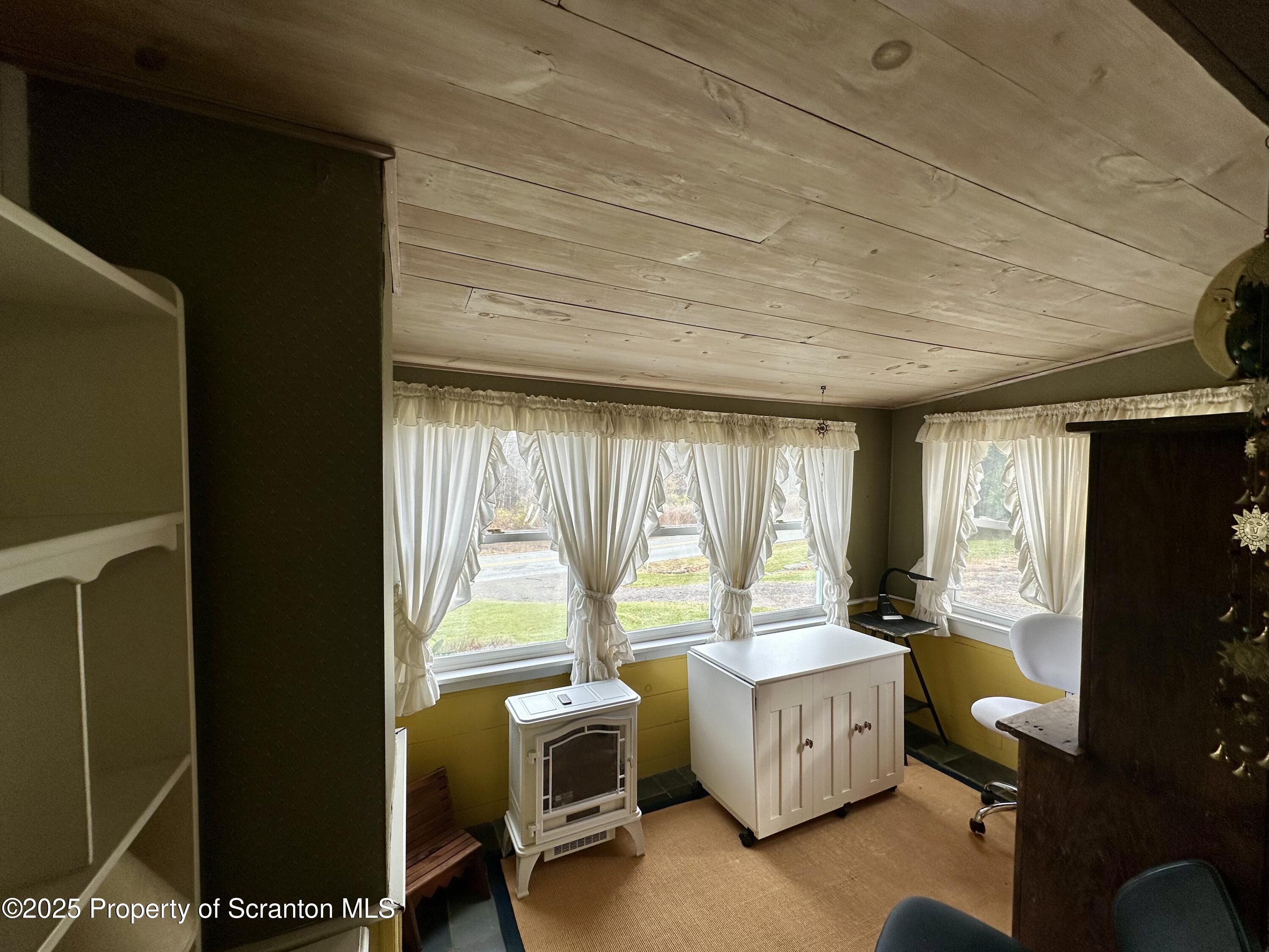 1033 Sugar Hollow Road Tunkhannock, PA 18657 - Photo 9 of 27 a bedroom with furniture and windows