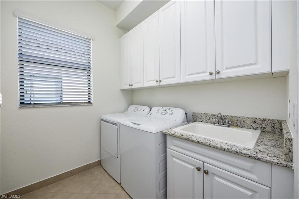 13459 Sumter Lane Naples, FL 34109 - Photo 18 of 33 a utility room with a sink washer and dryer