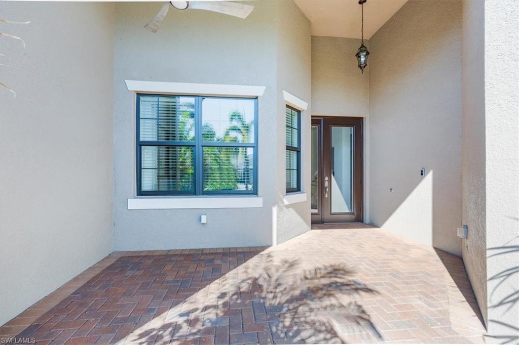 13459 Sumter Lane Naples, FL 34109 - Photo 2 of 33 a view of a bedroom with wooden floor and a window